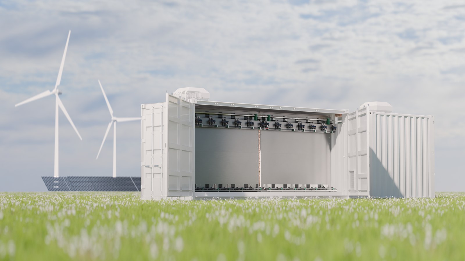 Technische installatie met witte containers en grijze tankstructuur omgeven door groene akker, windmolens en zonnepanelen zichtbaar