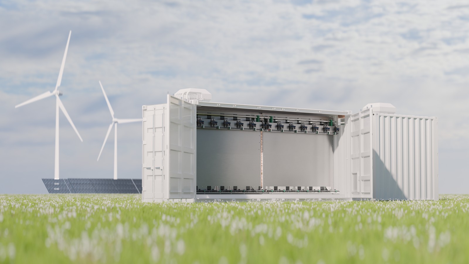 Technische installatie met witte containers en grijze tankstructuur omgeven door groene akker, windmolens en zonnepanelen zichtbaar